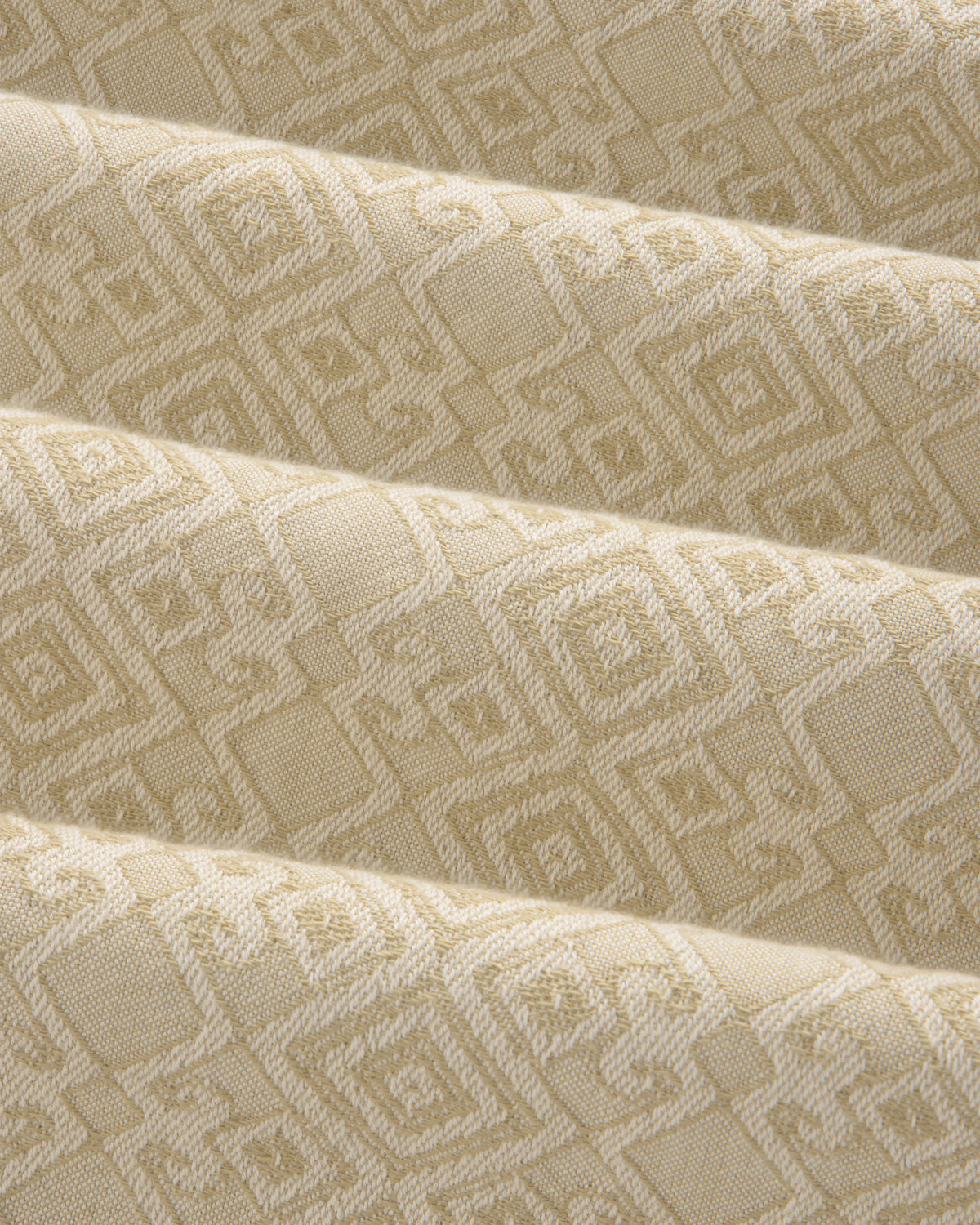 Jacquard Leisure Shirt in beige fabric with a subtle geometric pattern of squares and diamonds, shown with gentle folds.
