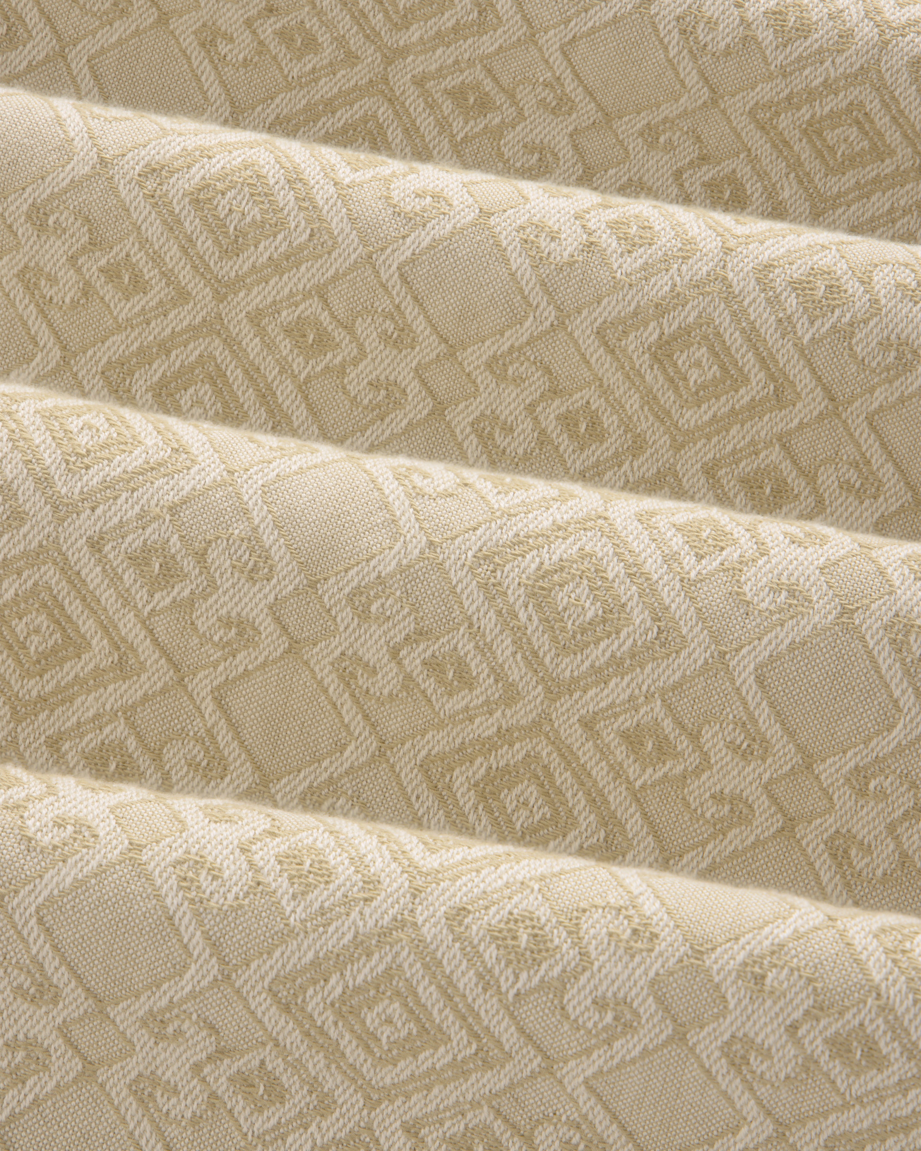 Jacquard Leisure Shirt in beige fabric with a subtle geometric pattern of squares and diamonds, shown with gentle folds.