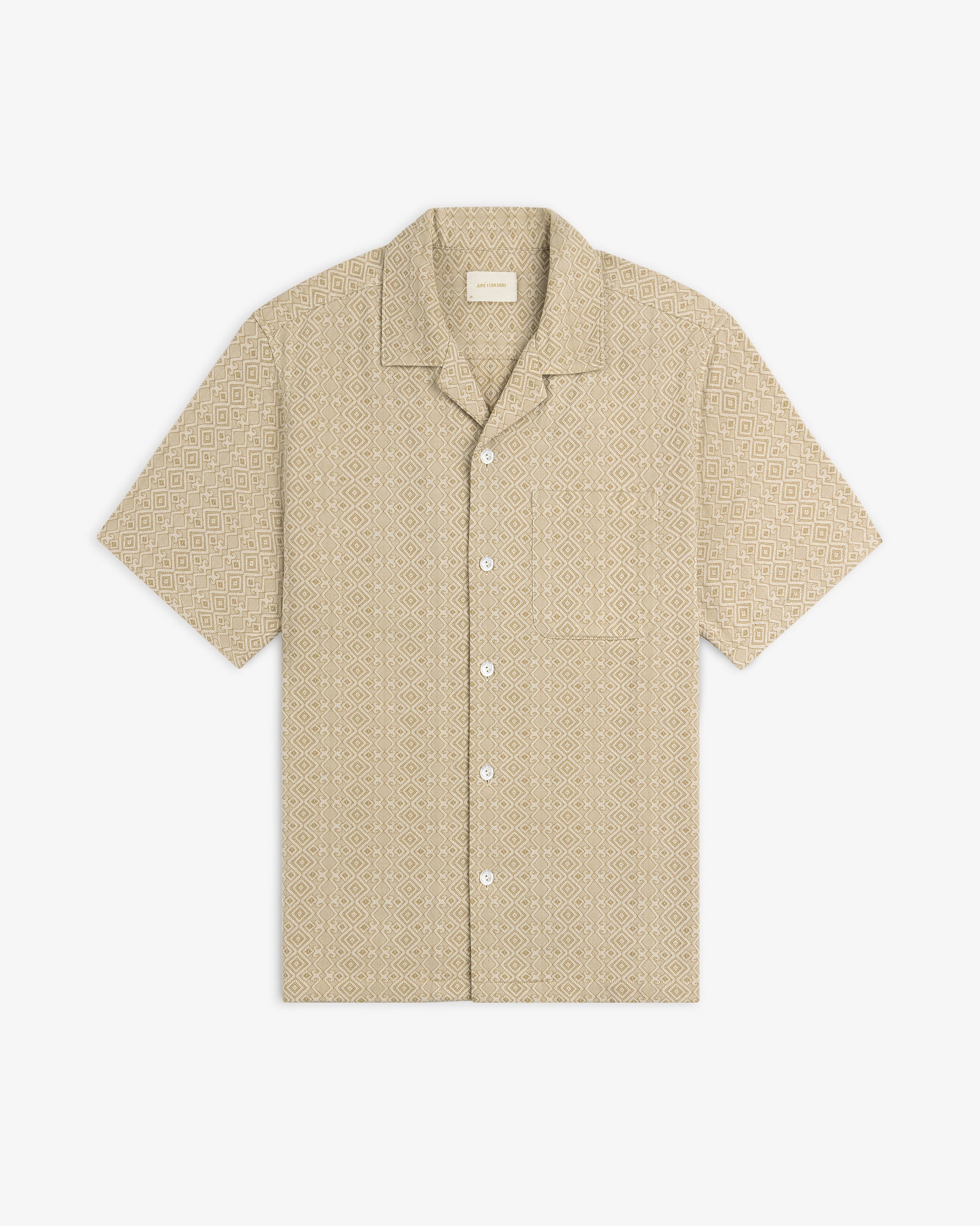 Jacquard Leisure Shirt: beige short-sleeve button-up with geometric diamond pattern and chest pocket, on white background.