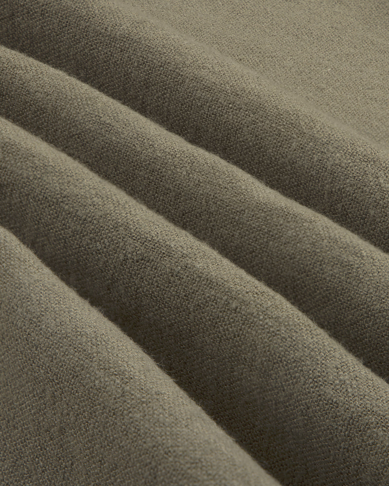 Close-up of the Linen Blend Leisure Shirt’s soft, brownish-grey fabric with gentle folds and textured weave.