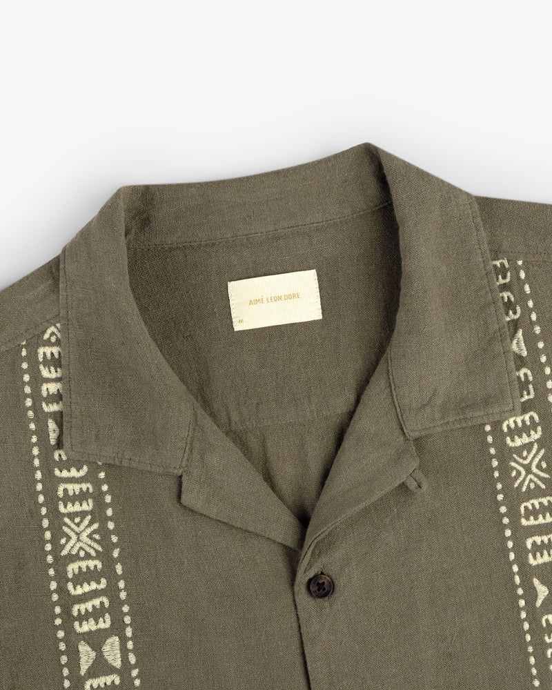 Olive green Linen Blend Leisure Shirt with cream embroidery and a visible interior label.