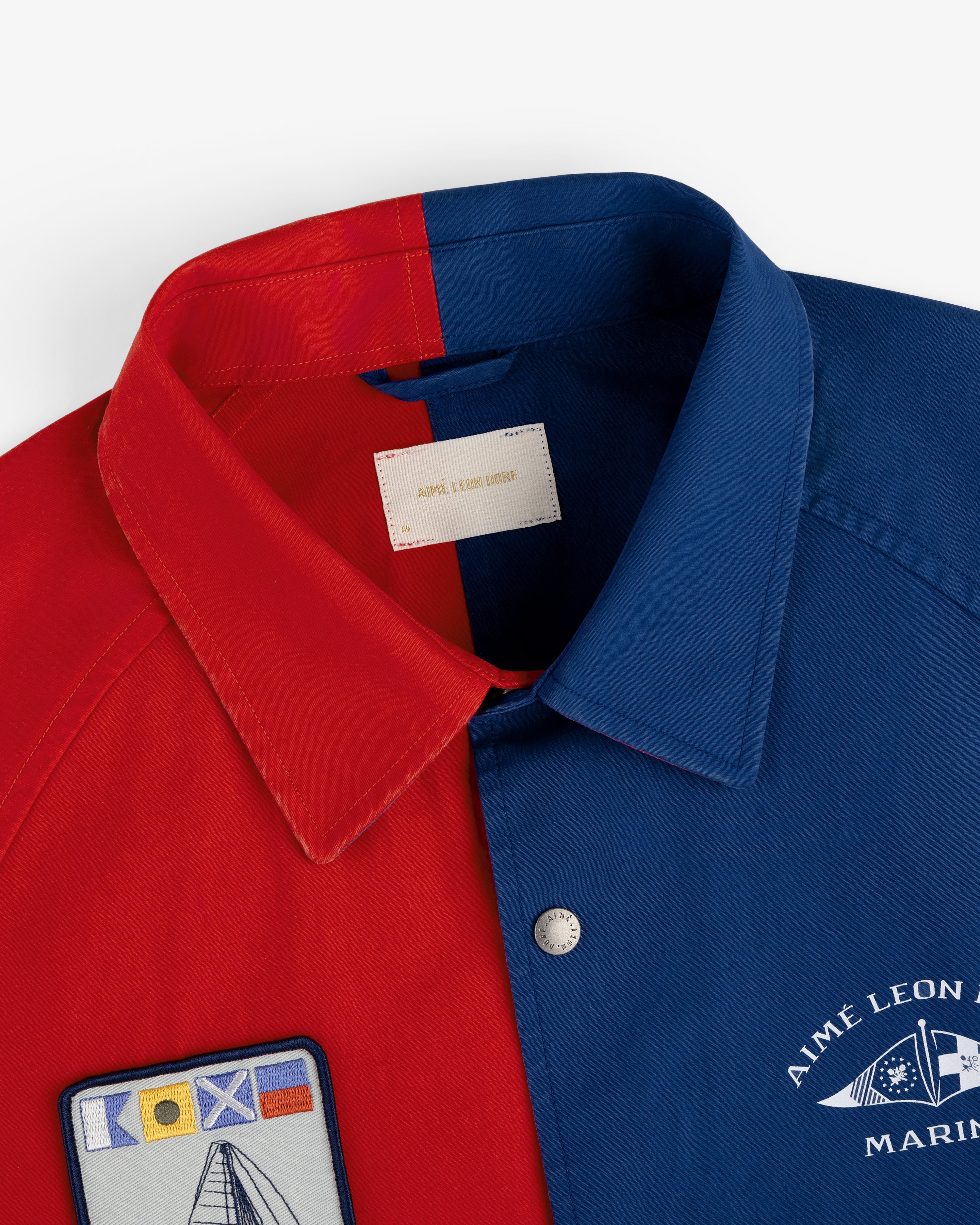 The Marina Jacket features red and blue panels, nautical patches, and an Aimé Leon Dore MARINE logo on blue.