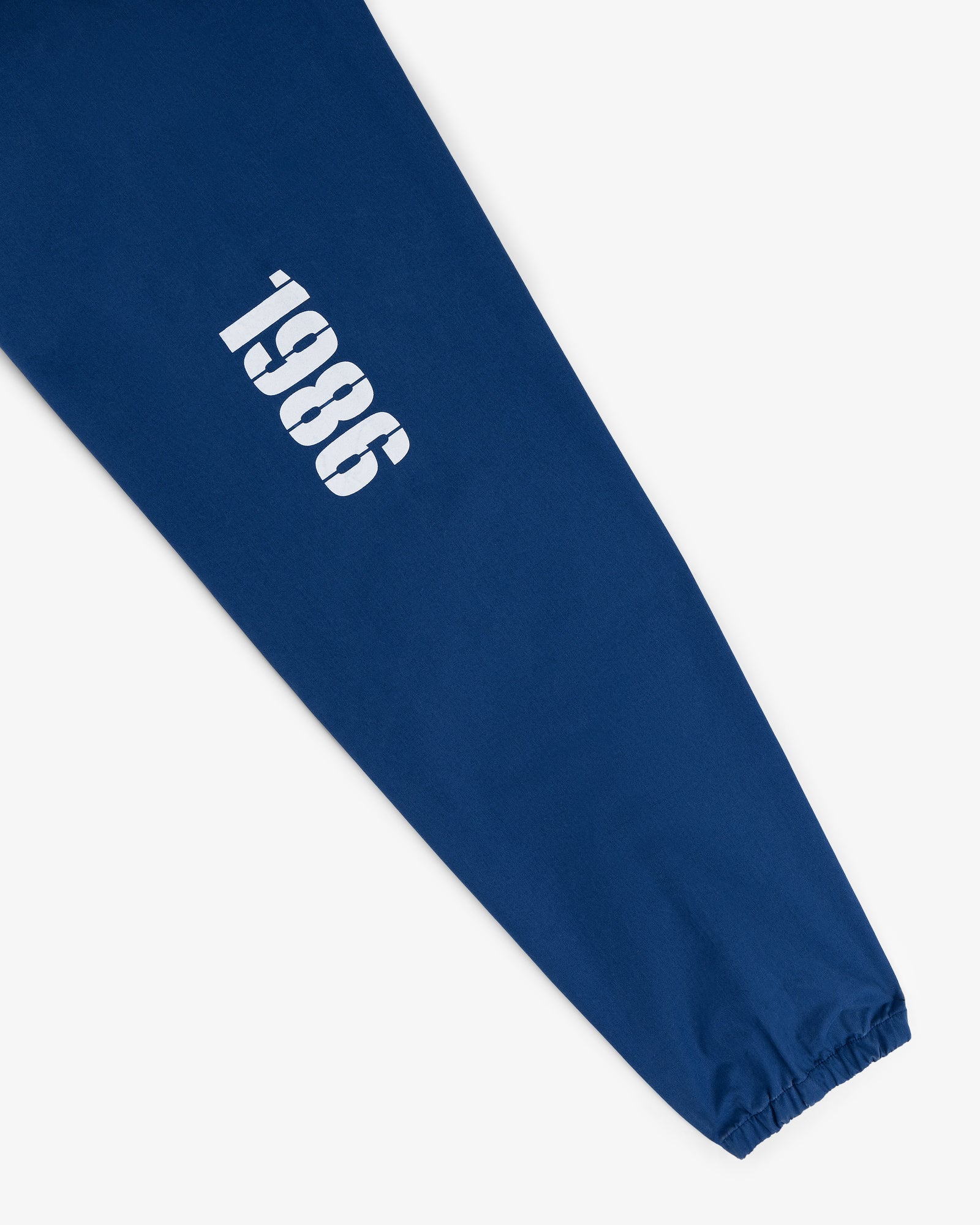 Marina Jacket with blue sleeves and bold white "1986" printed near the wrist.