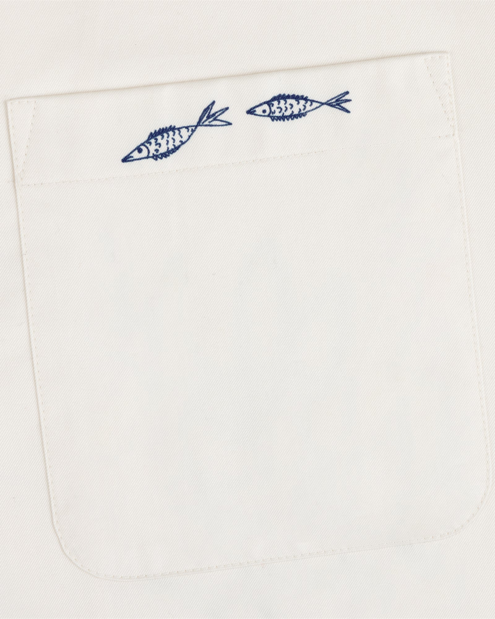 The Fassianos "Rendez - Vous" Camp Shirt features a white pocket with two small blue fish above the opening.