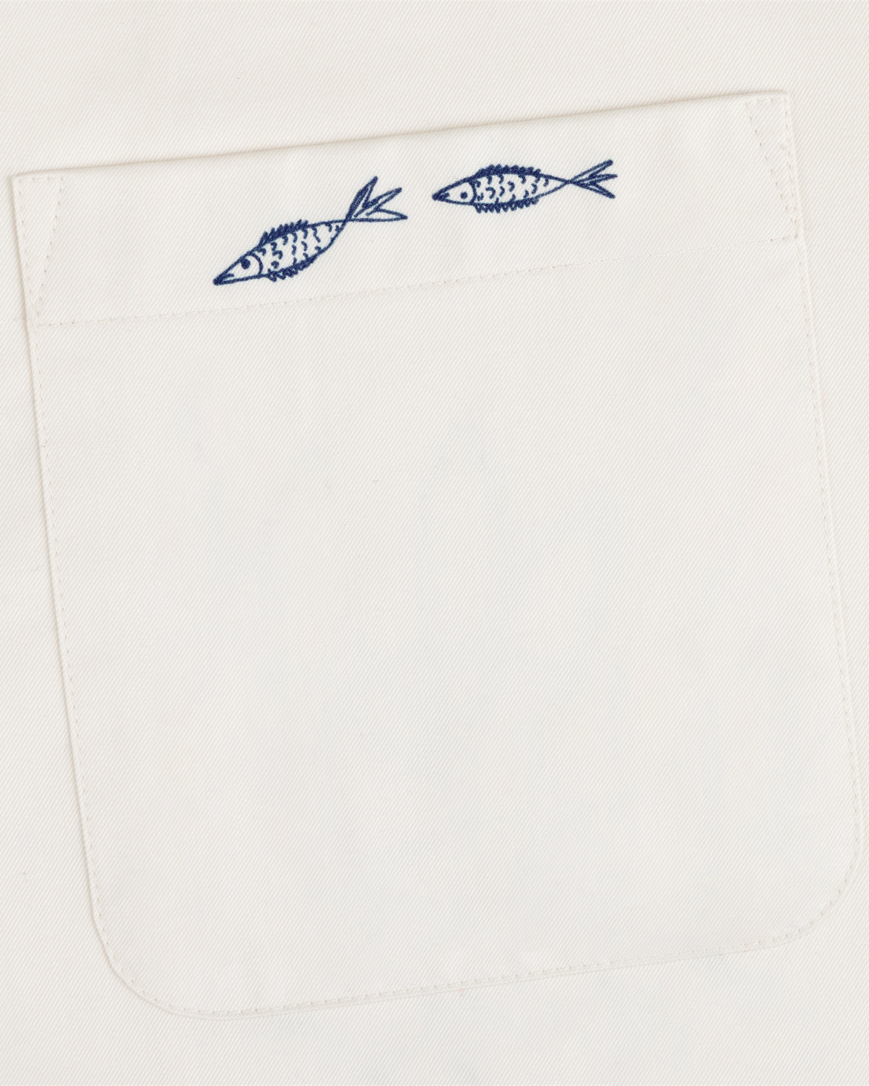 The Fassianos "Rendez - Vous" Camp Shirt features a white pocket with two small blue fish above the opening.