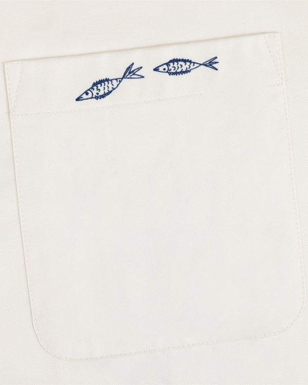 The Fassianos "Rendez - Vous" Camp Shirt features a white pocket with two small blue fish above the opening.
