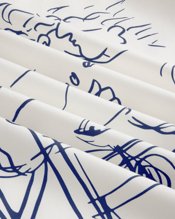 The Fassianos "Rendez - Vous" Camp Shirt features white fabric with thin blue line art and soft, diagonal folds.