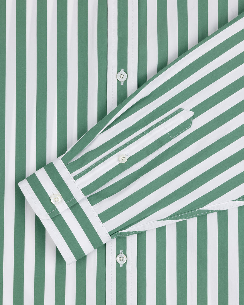 Striped Leon Overshirt in green and white with vertical stripes and front-crossed long sleeves showing the buttoned cuff.
