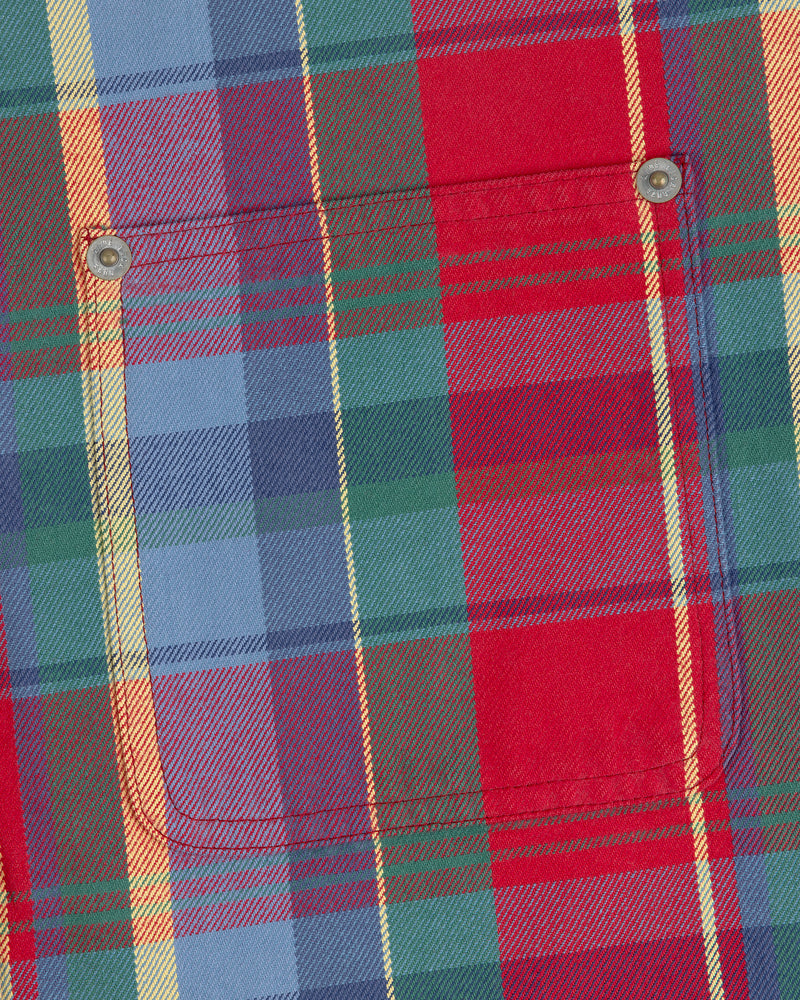 Close-up of a Plaid Work Shirt featuring red, blue, green, and yellow stripes with a front pocket.