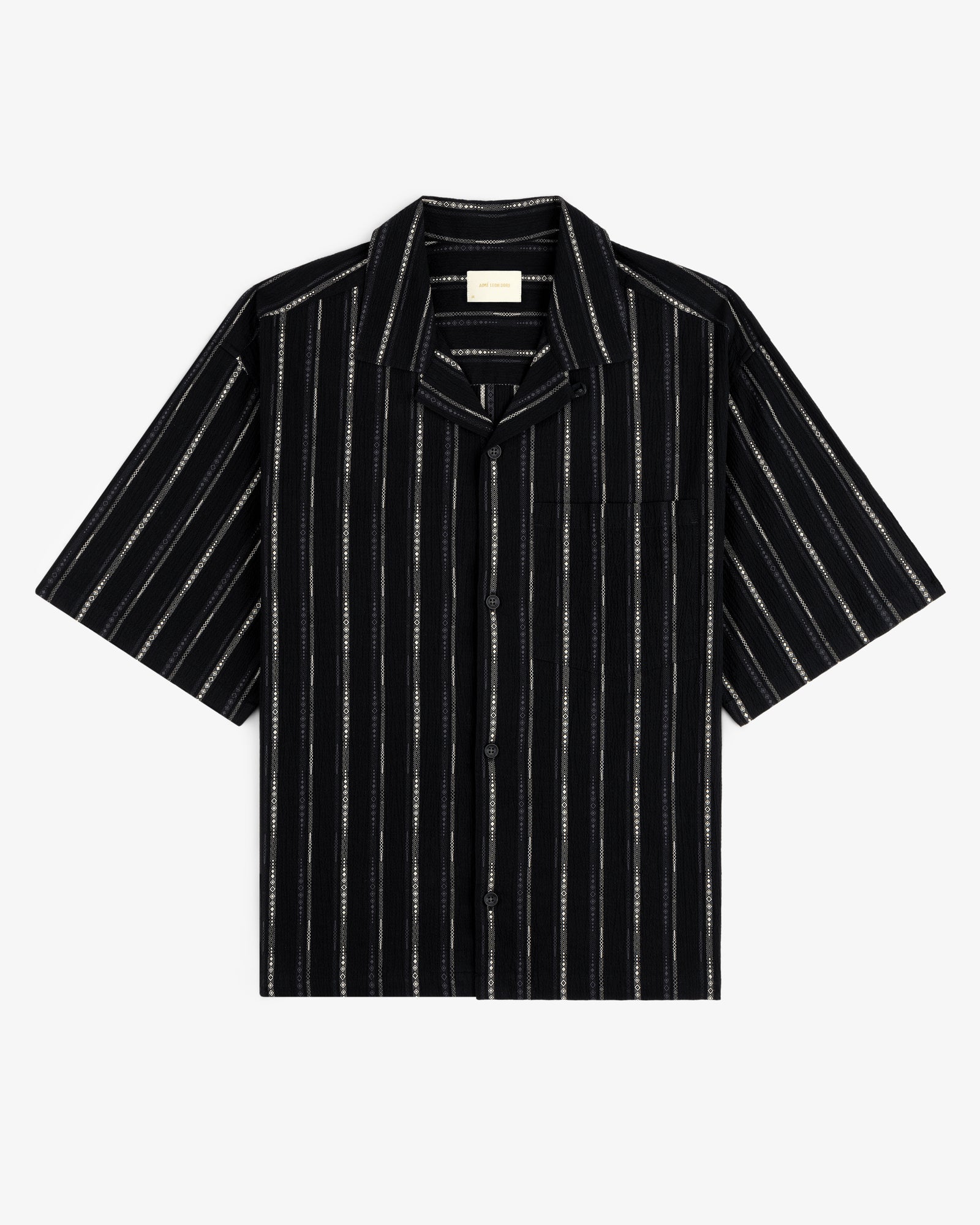 Cropped Jacquard Camp Shirt in black with vertical white stripes and a chest pocket, laid flat on white background.