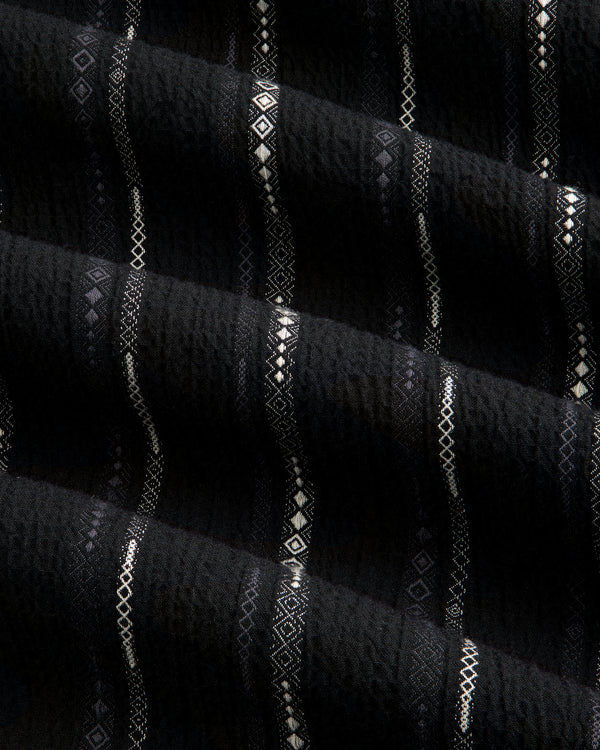Black Cropped Jacquard Camp Shirt featuring textured fabric with horizontal white geometric patterns and ridges.