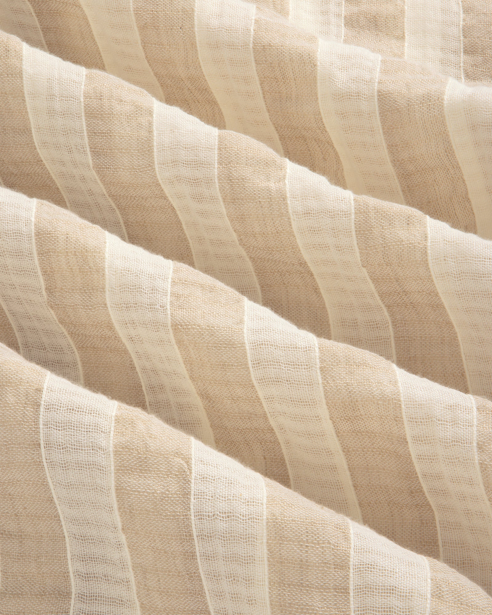 Close-up of Linen Blend Striped Camp Shirt featuring beige and white stripes, sheer texture, and soft wavy folds.