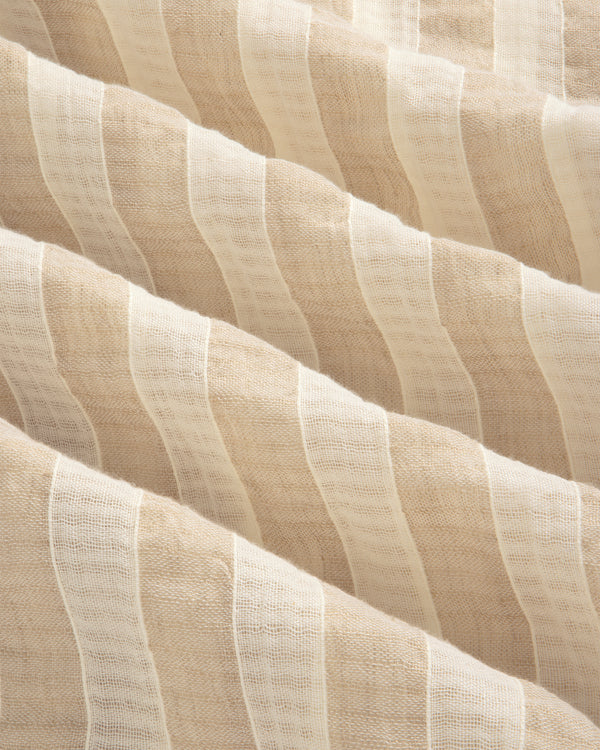 Close-up of Linen Blend Striped Camp Shirt featuring beige and white stripes, sheer texture, and soft wavy folds.