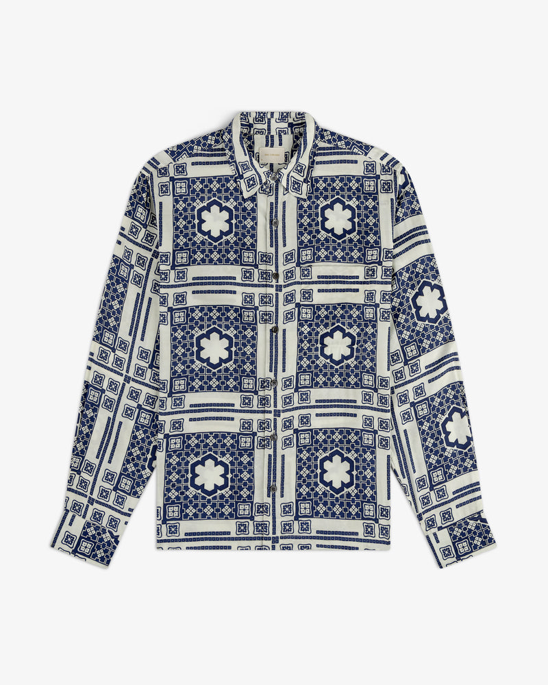 Mosaic Button Down Shirt with blue and white geometric floral tile pattern, laid flat on a white background.