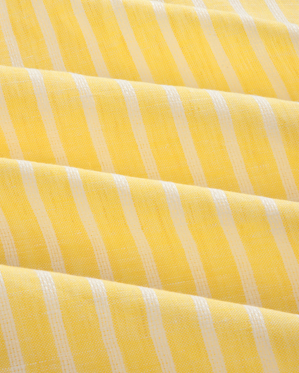 Yellow striped linen casual shirt with white vertical stripes and soft, even folds across the fabric.