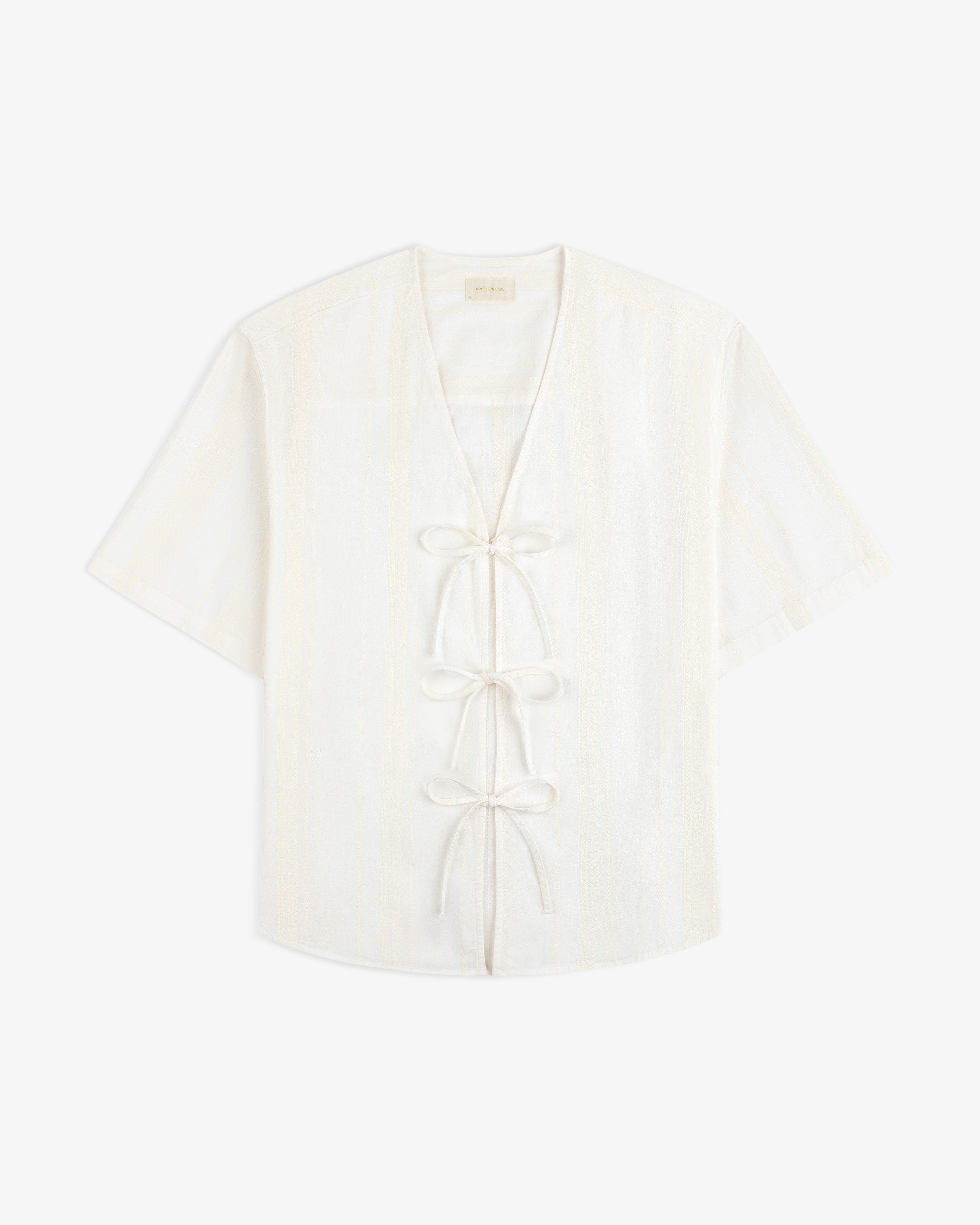 Jacquard Striped Tie-Front Shirt with short sleeves, V-neck, and three front ties, shown on a white background.