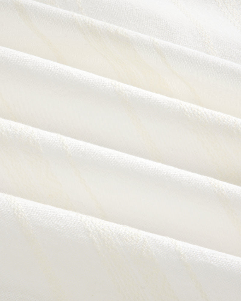 Close-up of Jacquard Striped Tie-Front Shirt showing folded white fabric with subtle diagonal textured lines.