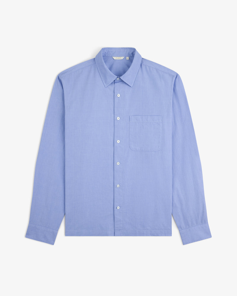 Poplin Casual Shirt in light blue, long-sleeve with chest pocket, laid flat on a white background.