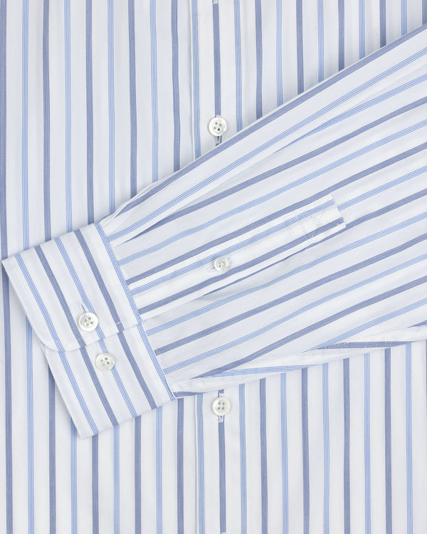 Close-up of a Poplin Casual Shirt featuring blue vertical stripes and white buttons on the cuff and front placket.