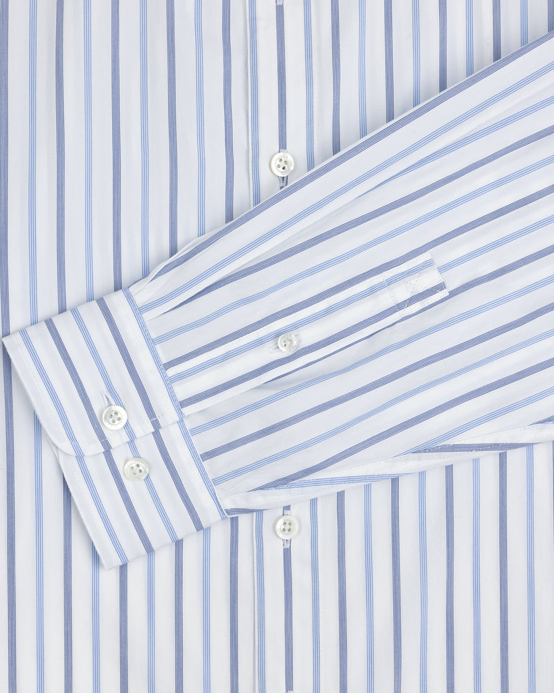 Close-up of a Poplin Casual Shirt featuring blue vertical stripes and white buttons on the cuff and front placket.