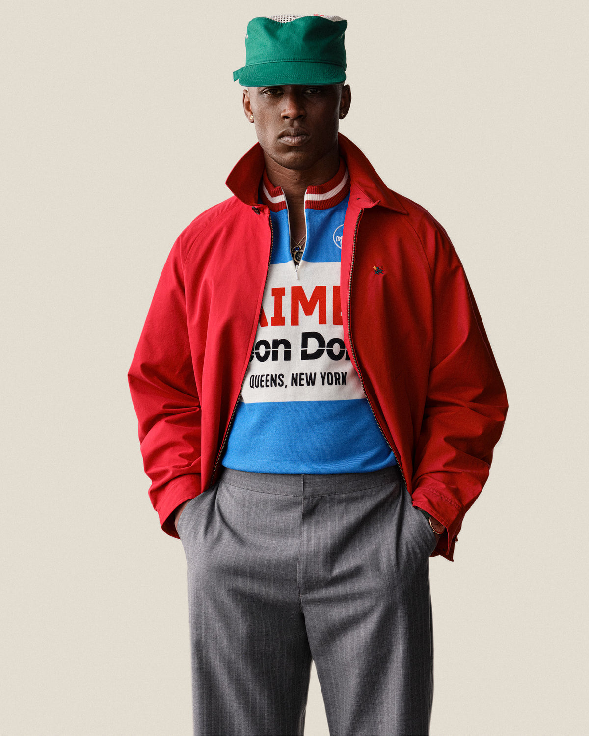 A man in a Merino Wool Cycling Jersey stands with hands in pockets against a plain background.