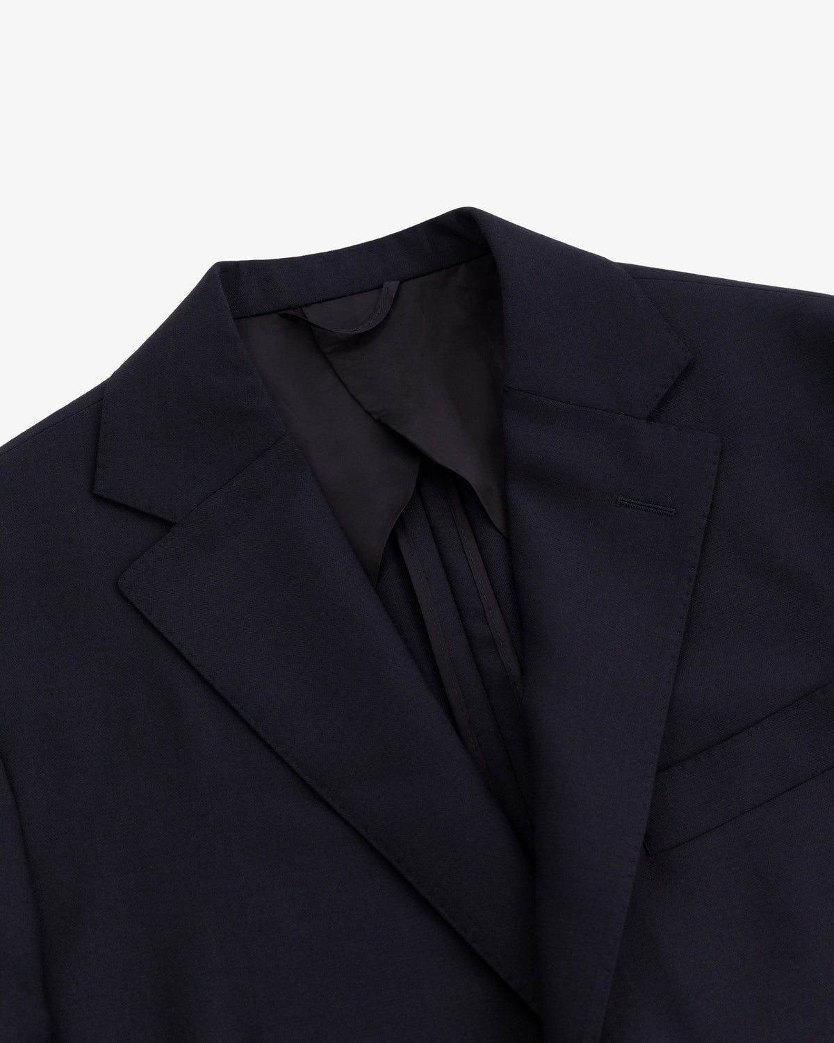 Close-up of the Tropical Wool Suit Jacket in black, featuring a notched lapel and chest pocket on a white background.