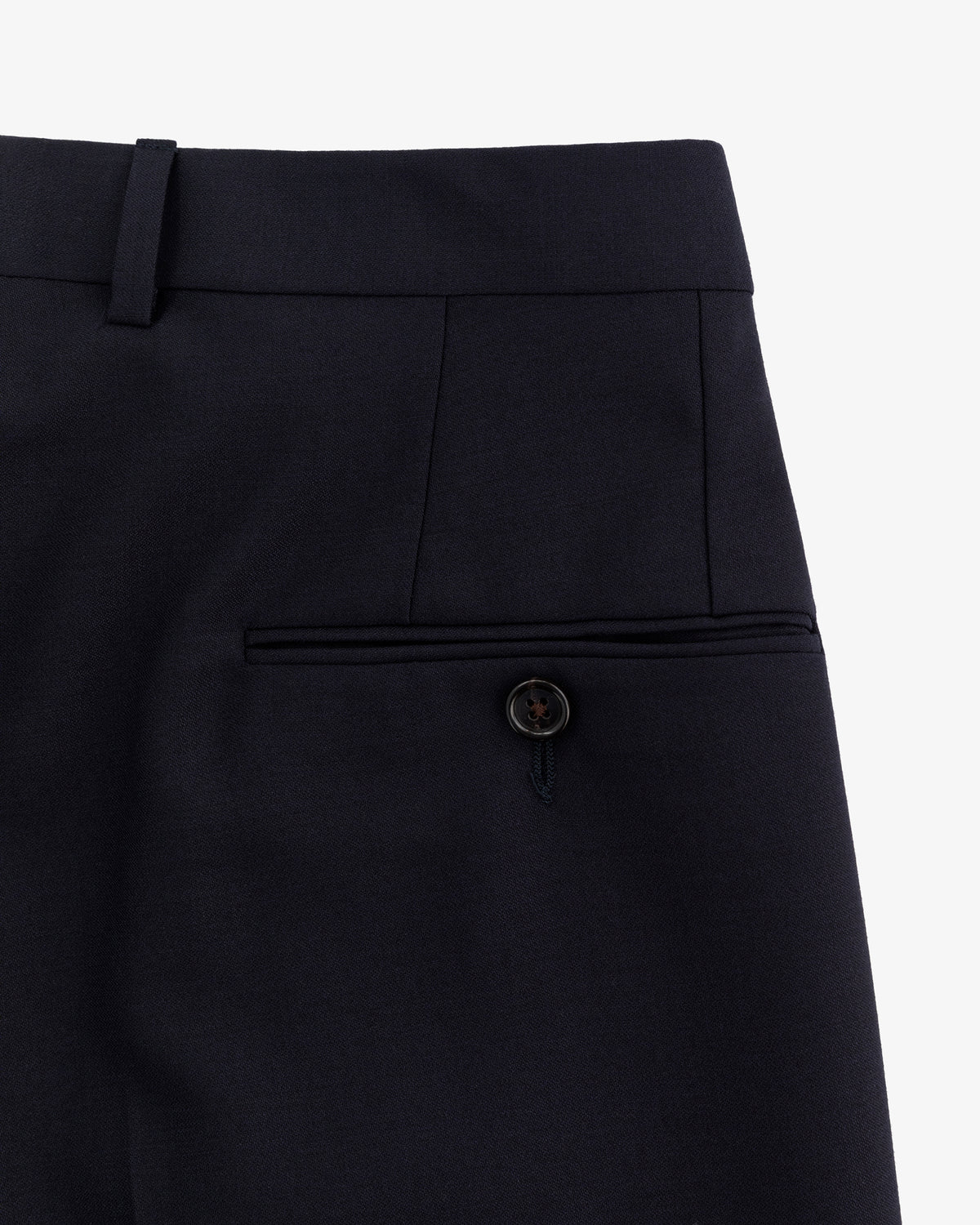 Close-up of Tropical Wool Suit Trouser in navy, featuring a buttoned back pocket and waistband with belt loop.