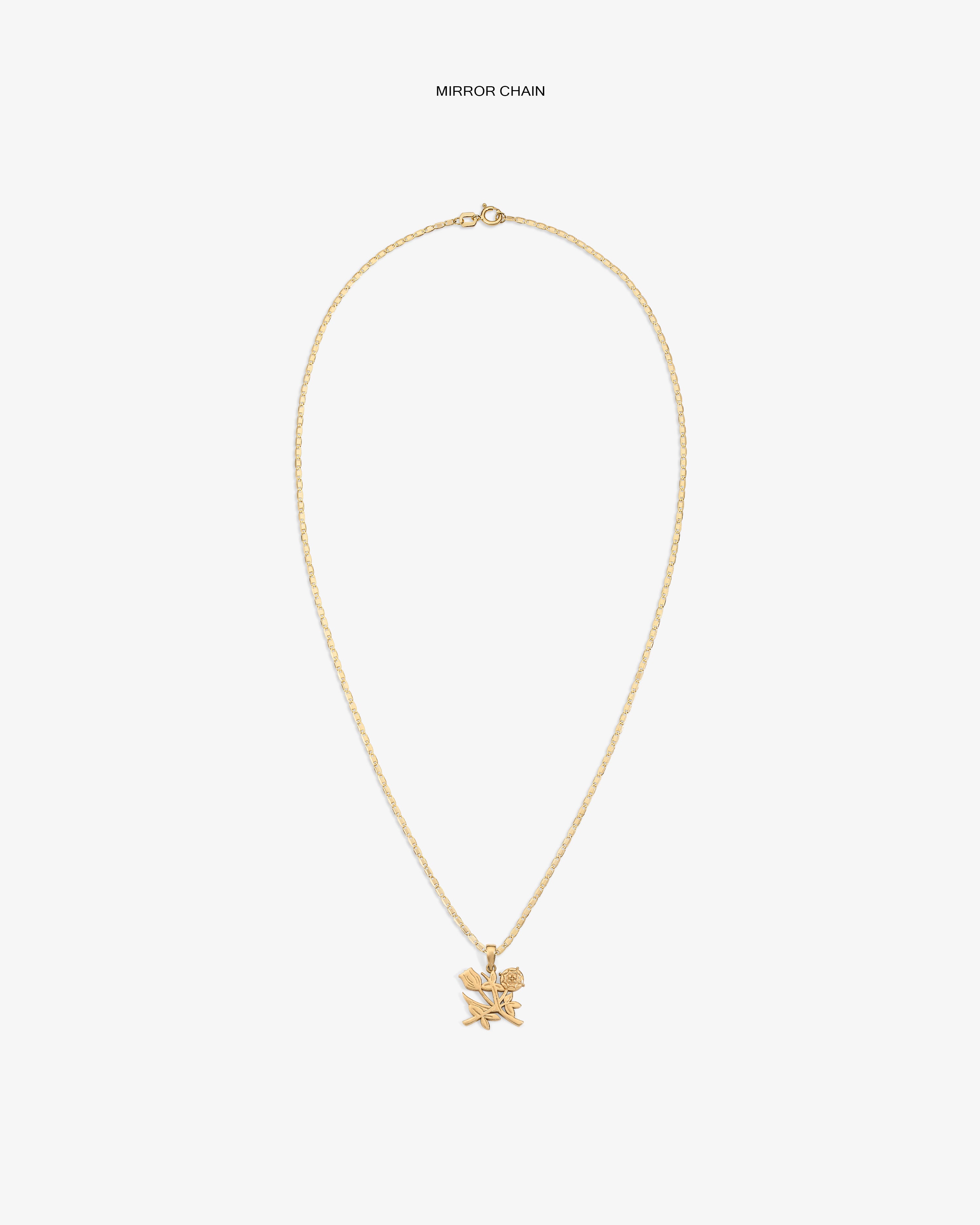 14Kt Gold Pendant with two small star and rose charms shown against a plain white background.