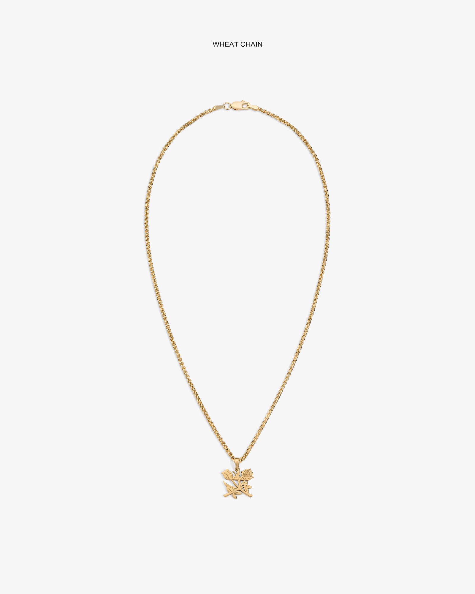14Kt Gold Pendant necklace with a wheat chain and star pendant on a plain white background.