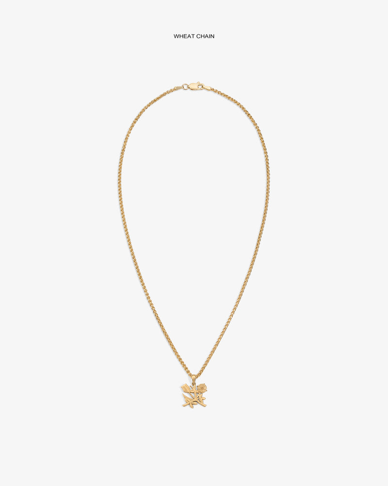 14Kt Gold Pendant necklace with a wheat chain and star pendant on a plain white background.