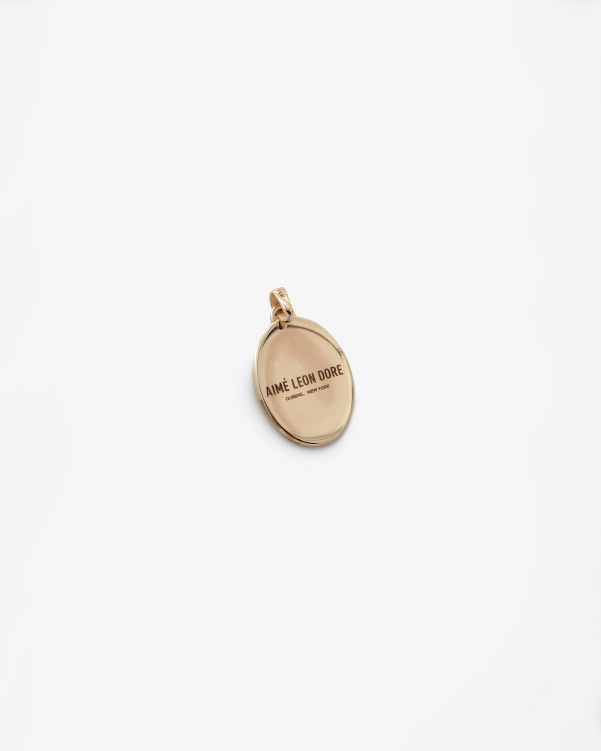 14Kt Gold Pendant engraved with AIMÉ LEON DORE on a white background.