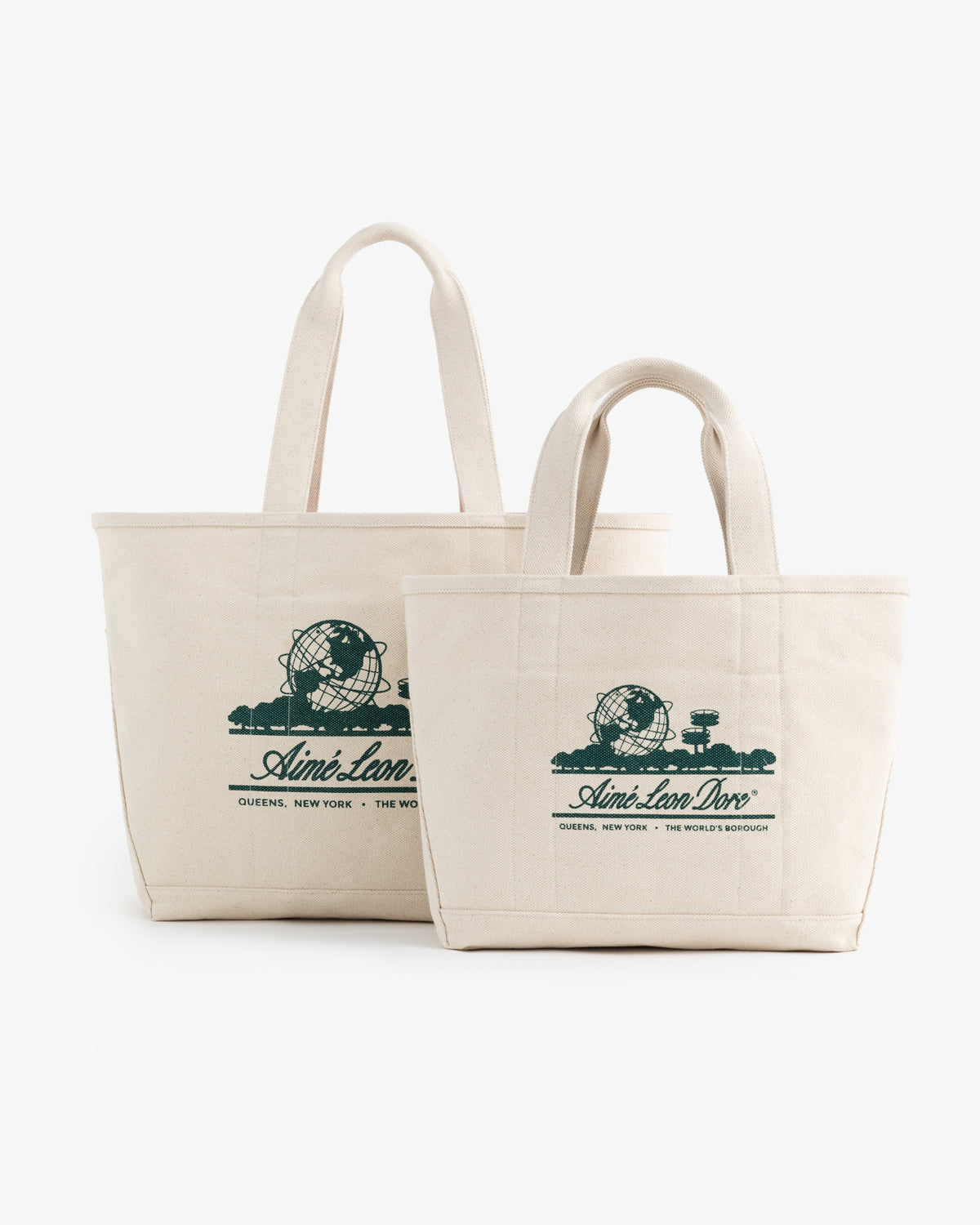 Two Small Unisphere Tote Bags in beige with green Aimé Leon Dore graphics, placed side by side.