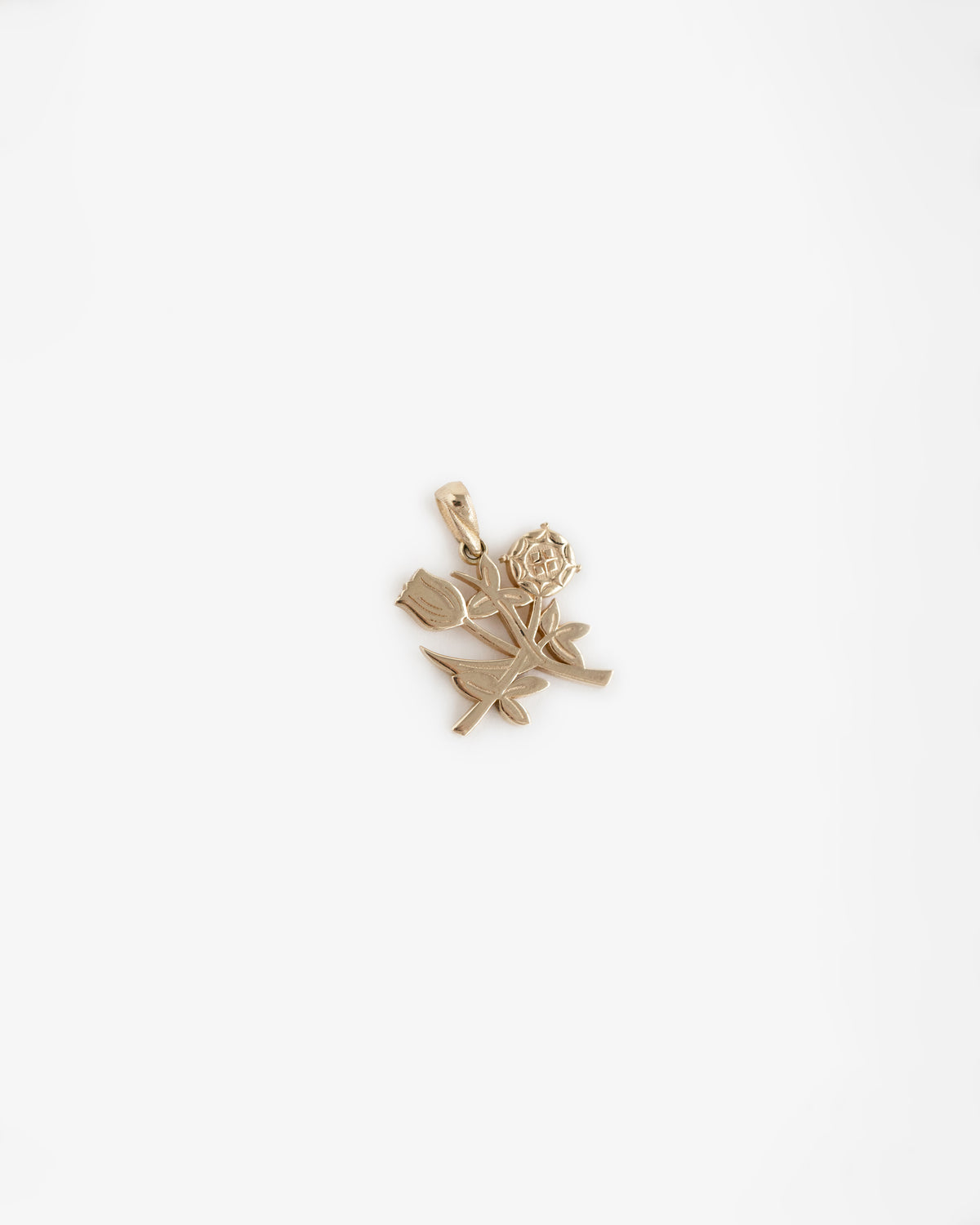 14Kt Gold Pendant shaped like a blooming rose with leaves and bud, shown on a plain white background.