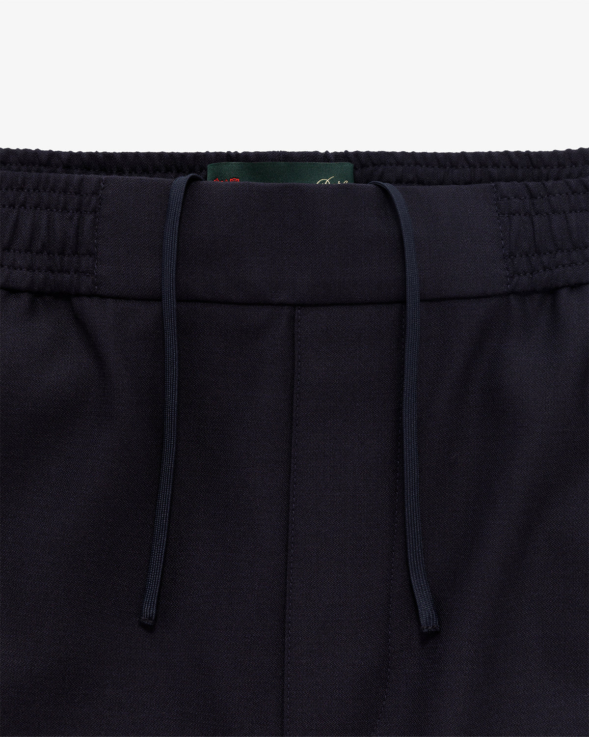 Close-up of Tropical Wool Elasticated Waist Suit Trouser waistband with elastic sections and drawstrings on white background.