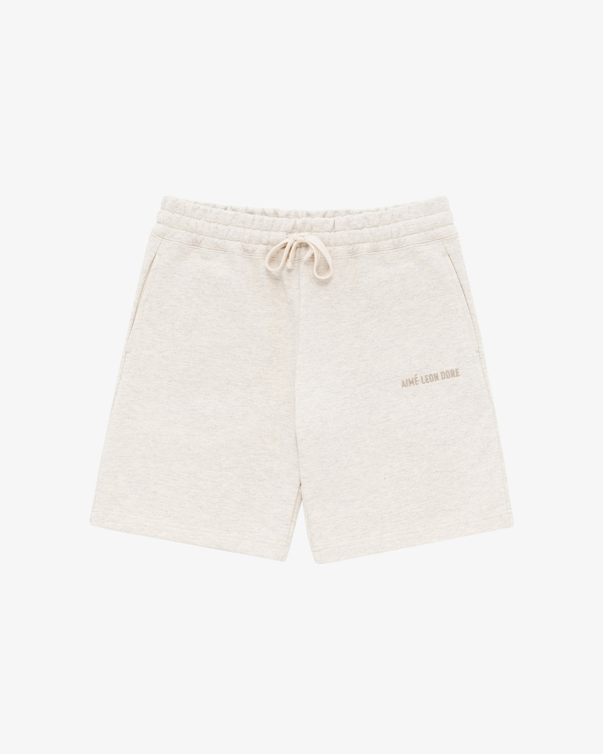 Tonal Logo Sweatshorts in beige with side pockets and small logo on the left thigh, displayed on a white background.