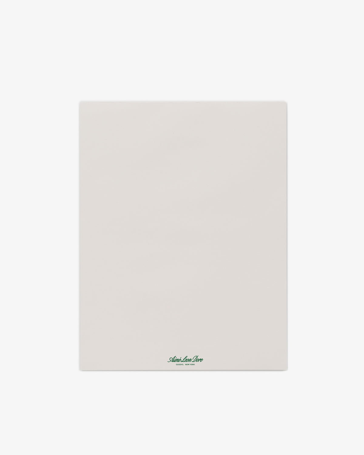 A Large Sketch Pad featuring a blank white sheet with small green text at the bottom center on a plain background.