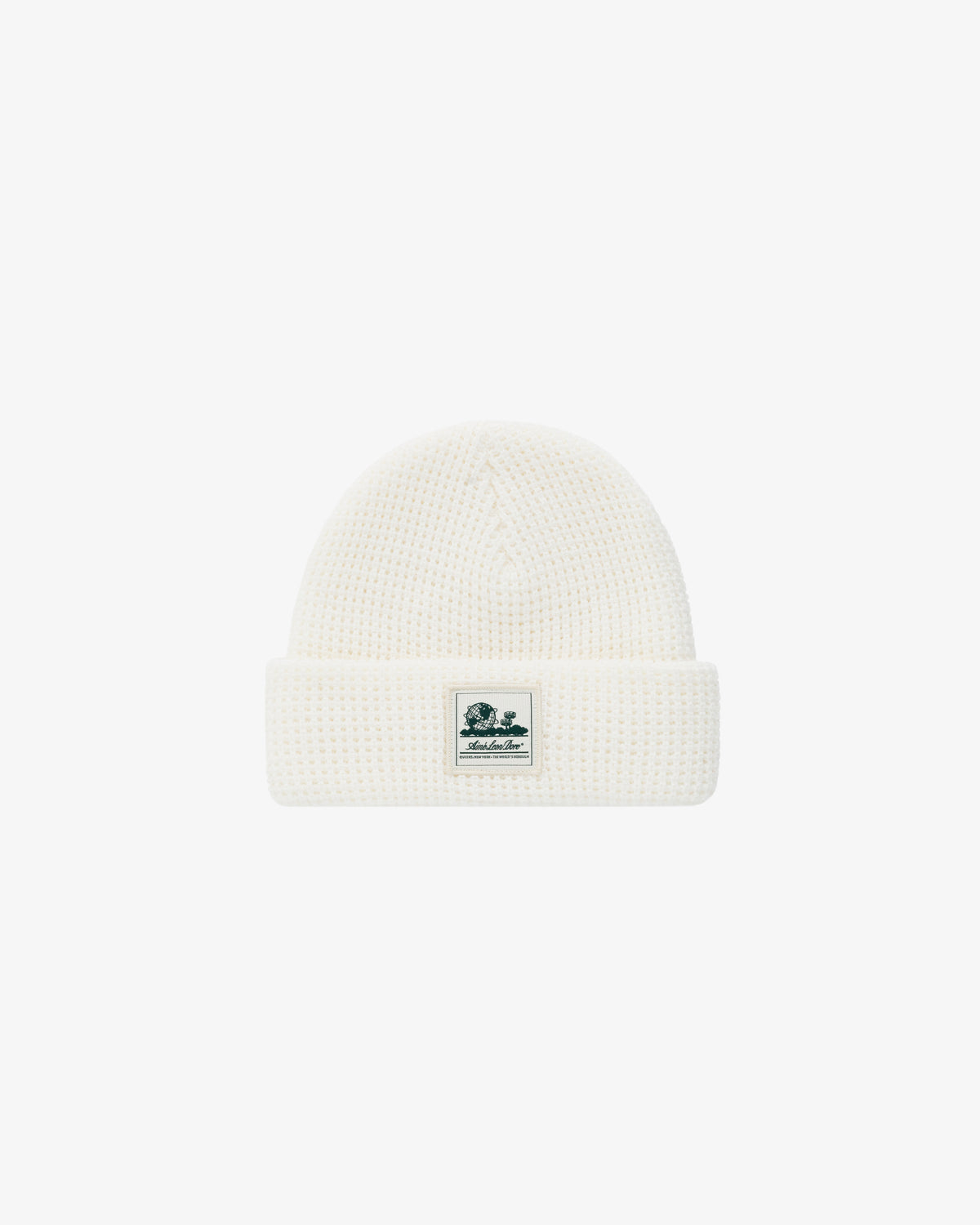 Waffle Knit Beanie in white with a folded brim and a small rectangular logo patch on the front center.