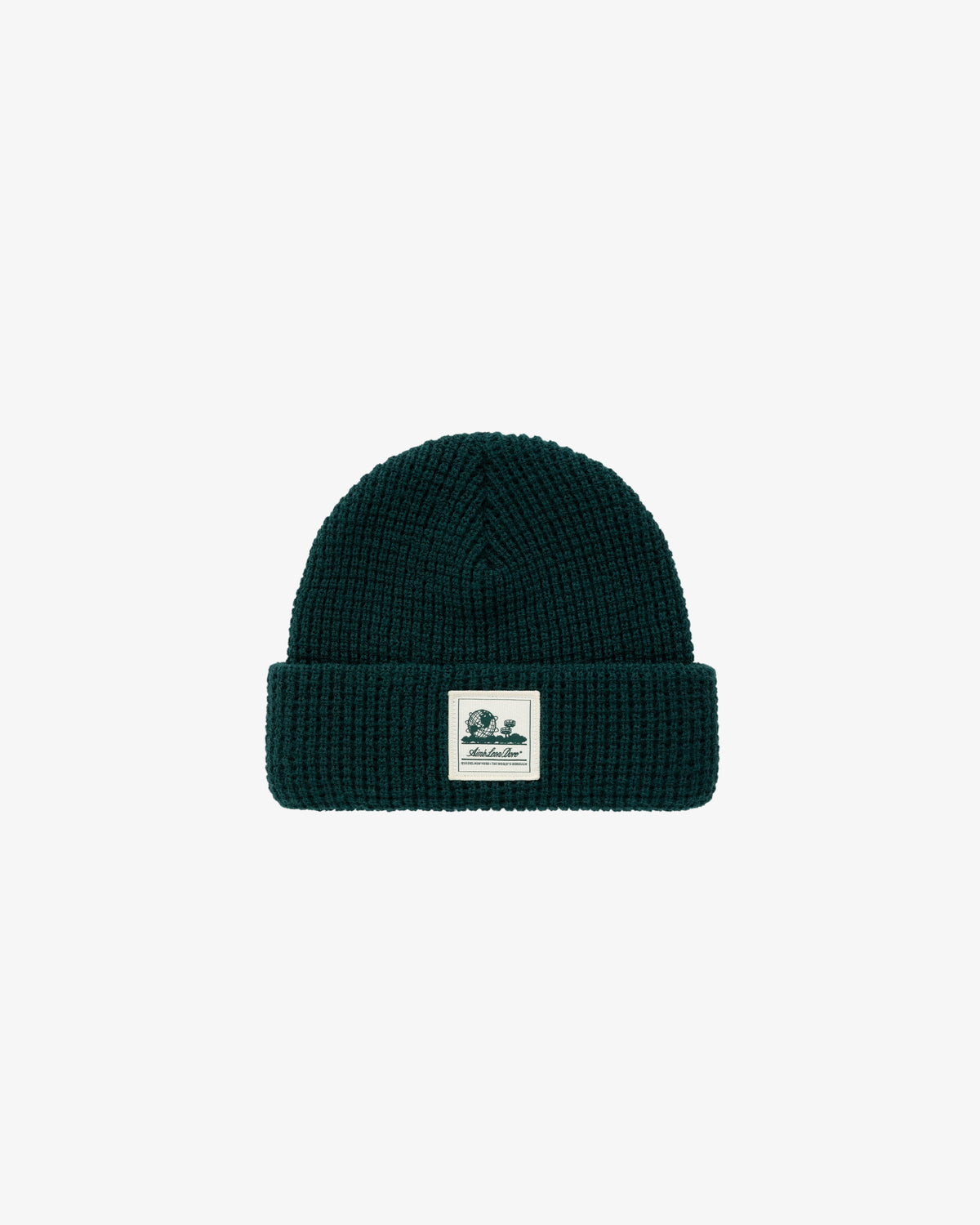 Dark green Waffle Knit Beanie with a folded brim and a white rectangular patch on the front.